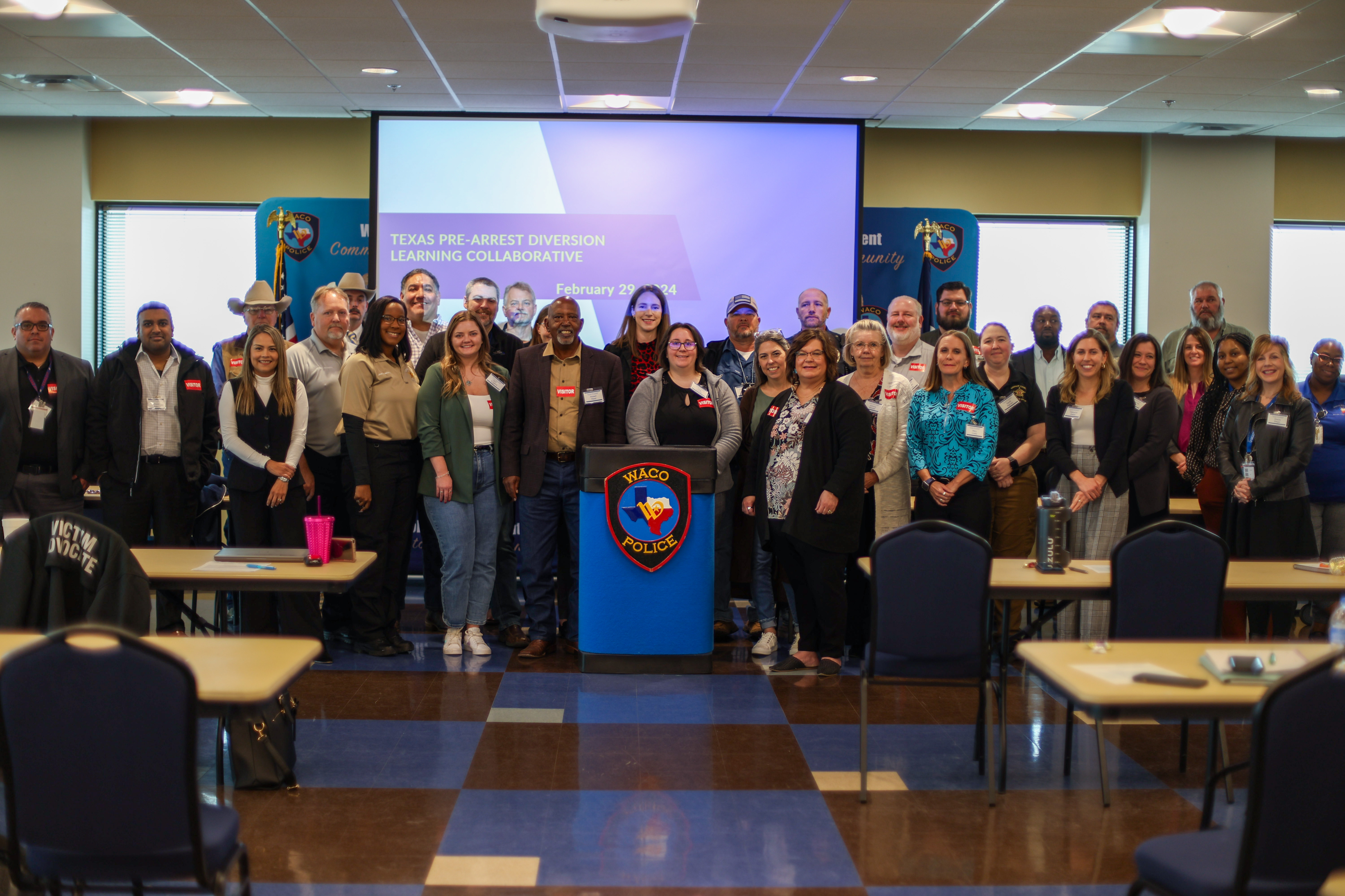 A group photo of attendants at the Pre-Arrest Diversion Learning Collaborative meeting.