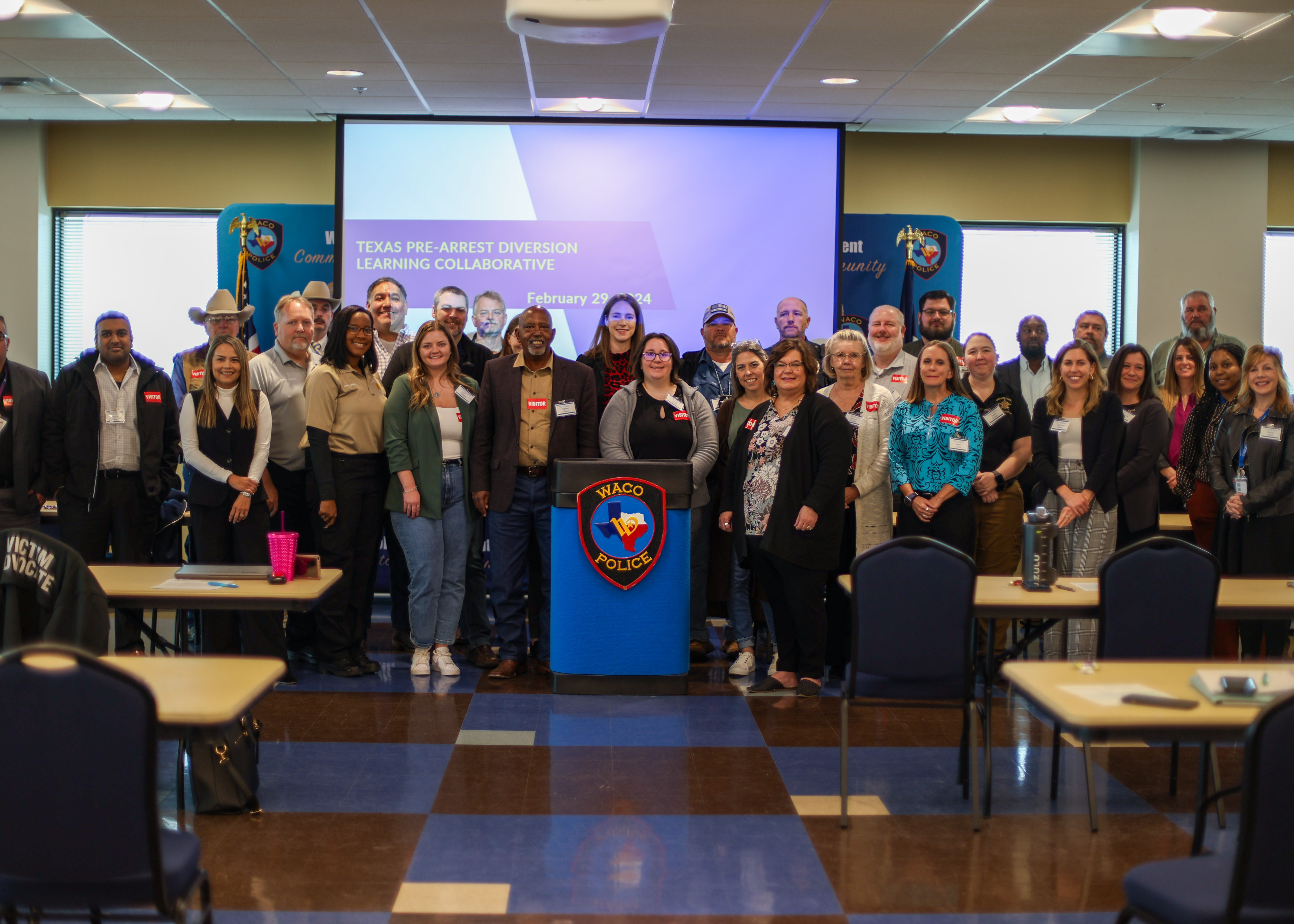 A group photo of attendants at the Pre-Arrest Diversion Learning Collaborative meeting.